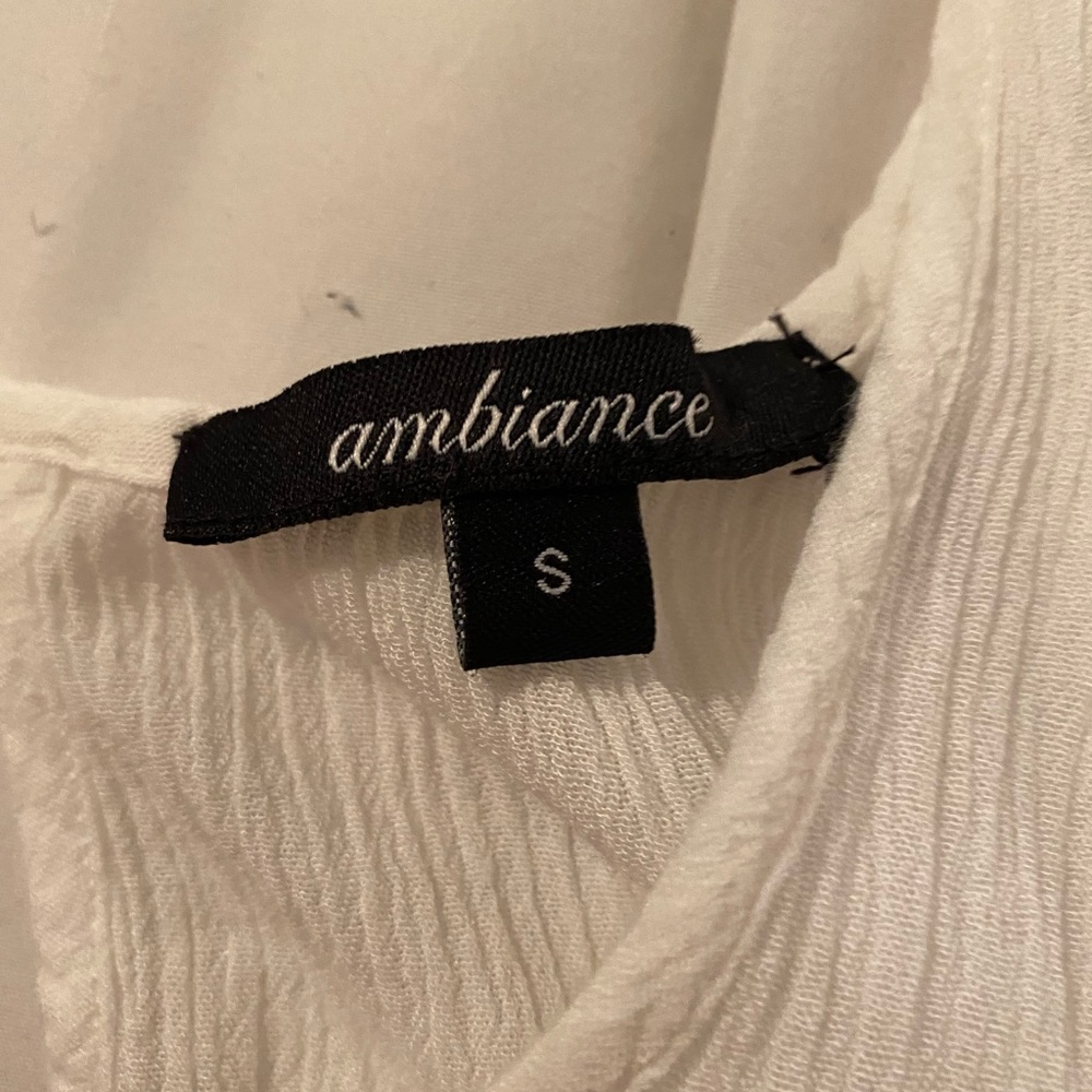 White hanging sleeve top